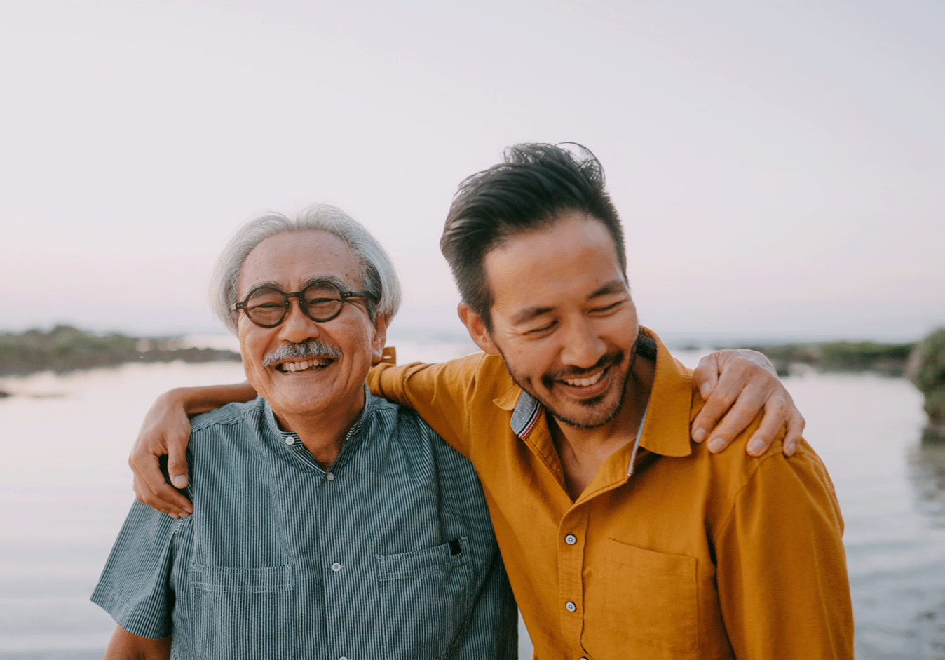Man embracing his elderly father